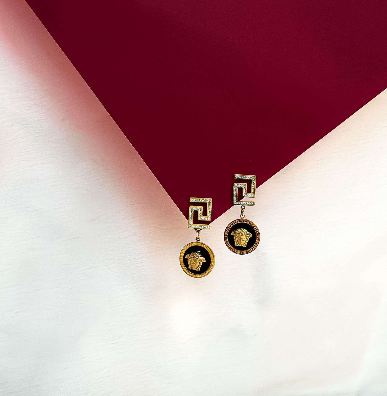 Symbolic Splendor: Western Earrings Featuring Swastika Motif and Striking Golden Jaguar Face